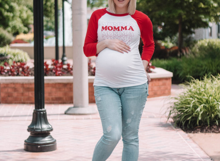 Taylor showcasing "momma" maternity top for Memorial Day